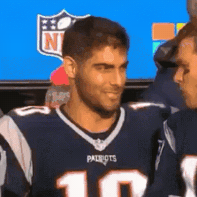 Man In Patriots Jersey Standing Next To Another Man GIF