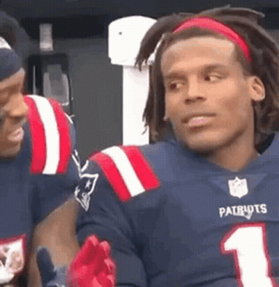 Man In Patriots Jersey Talking To Football Player GIF