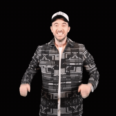Man In Patterned Shirt And Hat Flexing Muscles GIF