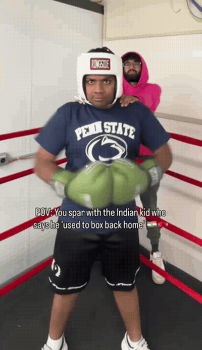 Man In Penn State Shirt And Boxing Gloves GIF