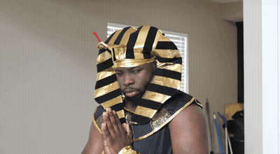 Man In Pharaoh Costume Hands Folded GIF