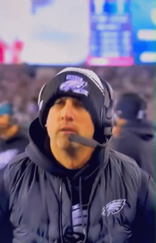 Man In Philadelphia Eagles Hat Talking Into Microphone GIF