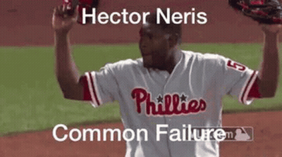Man In Phillies Jersey Holding Glove Over Head GIF
