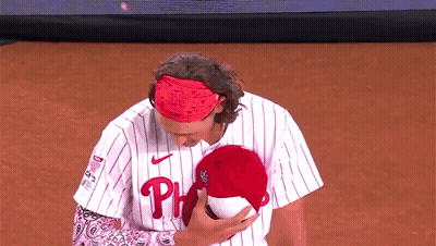 Man In Phillies Jersey Holding Stuffed Animal GIF