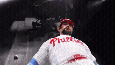 Man In Phillies Jersey Laying Down GIF