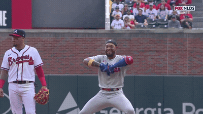 Man In Phillies Jersey On Baseball Field GIF