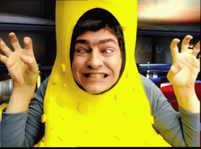 Man In Pickle Costume Making A Face GIF