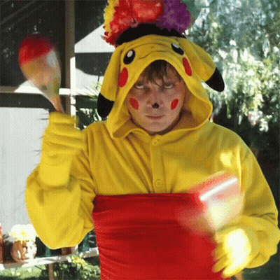 Man in Pikachu Costume Holding Maracas