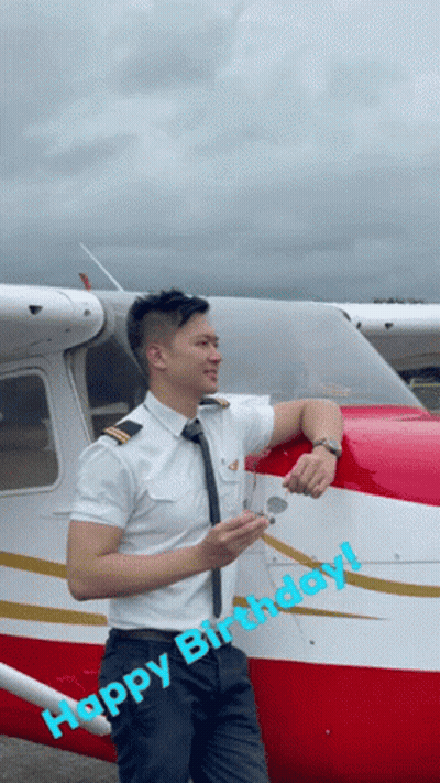 Man In Pilot Uniform Leaning Against Airplane Saying Happy Birthday GIF