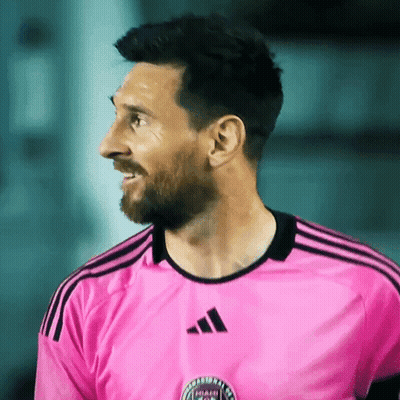Man In Pink Adidas Shirt Smiles GIF