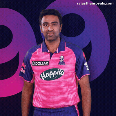 Man In Pink And Blue Shirt With Dollar Logo GIF