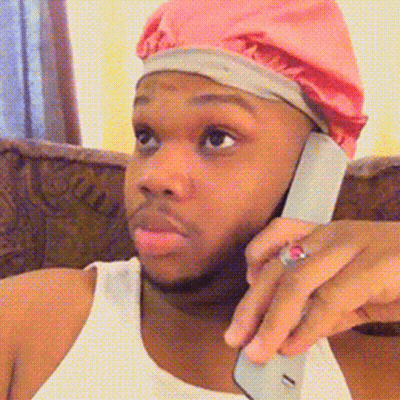 Man In Pink Beanie Talking On Cell Phone GIF