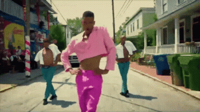 Man In Pink Crop Top Walking Down Street GIF