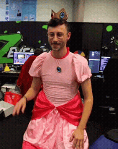 Man In Pink Dress And Crown Standing GIF