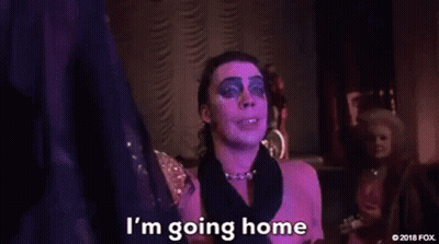 Man In Pink Dress Holding Cake Smiling GIF