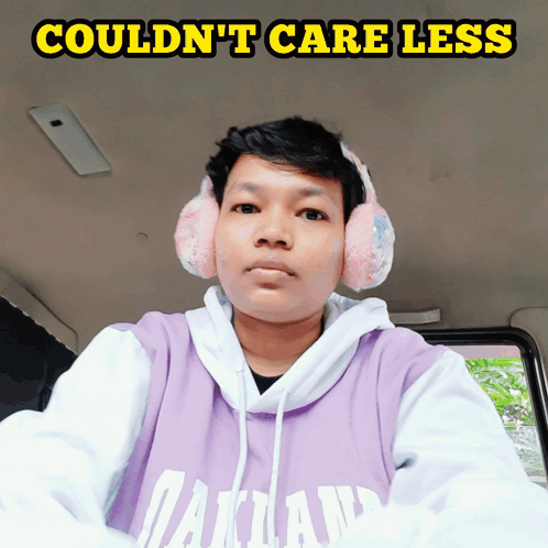 Man In Pink Ear Muffs And Purple Hoodie Couldn't Care Less GIF