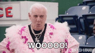 Man In Pink Feathered Outfit Saying Woooo GIF
