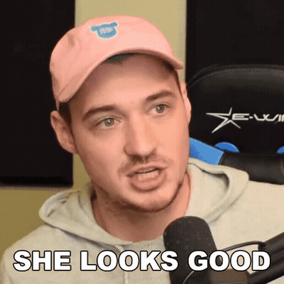 Man In Pink Hat And Hoodie Says She Looks Good GIF