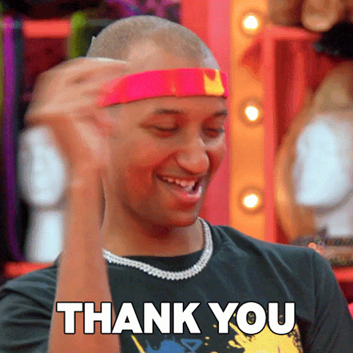 Man In Pink Headband And Necklace Saying Thank You GIF