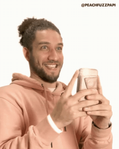 Man In Pink Hoodie Holding Cell Phone GIF