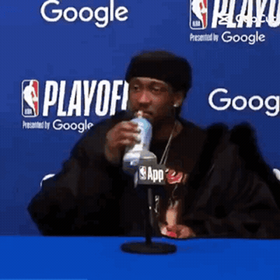 Man In Pink Hoodie Next To Man In Black Jacket GIF