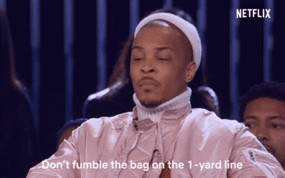 Man In Pink Jacket And White Hat Saying Don't Fumble The Bag On The 1 Yard Line GIF