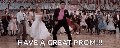 Man In Pink Jacket Dancing With Woman In White GIF