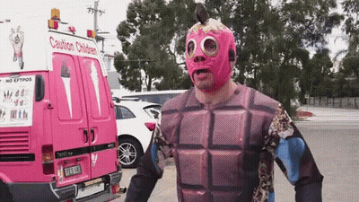 Man In Pink Mask In Front Of Pink Caution Children Van GIF