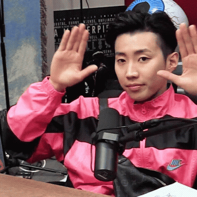 Man In Pink Nike Jacket Waving Hands GIF