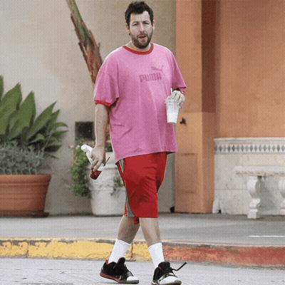 Man In Pink Puma Shirt And Red Shorts Walking GIF