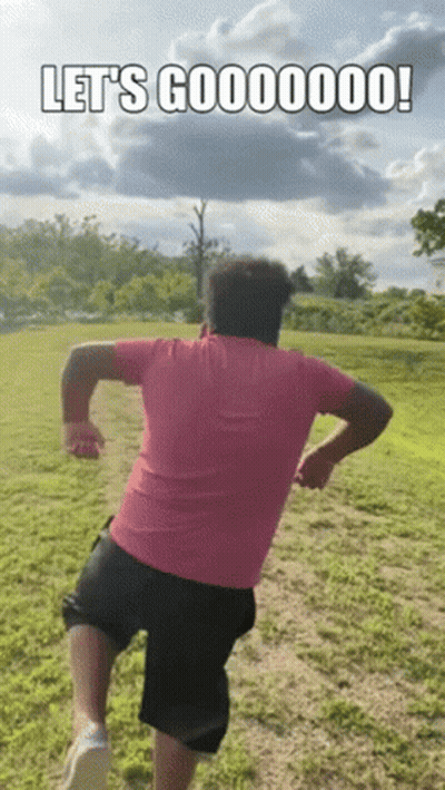 Man In Pink Shirt And Black Shorts Running GIF