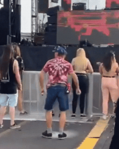 Man In Pink Shirt And Blue Shorts Dancing GIF