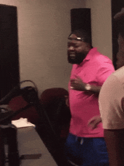 Man In Pink Shirt And Blue Shorts GIF