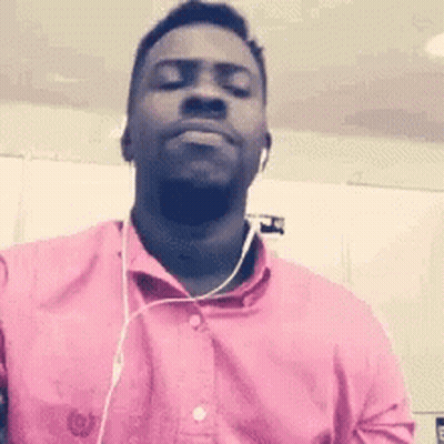 Man In Pink Shirt And Headphones Making Face GIF