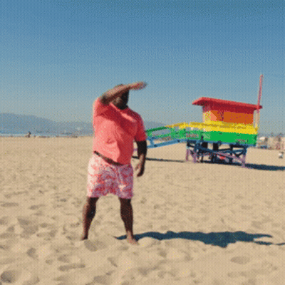 Man In Pink Shirt And Shorts On Beach GIF