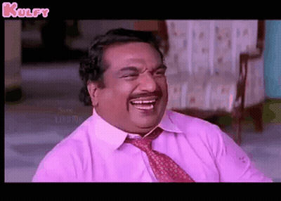 Man In Pink Shirt And Tie Laughing On Chair GIF