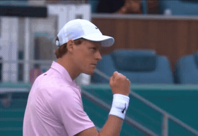 Man In Pink Shirt And White Hat With Nike Logo GIF