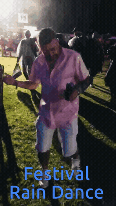 Man In Pink Shirt Dancing At Festival GIF