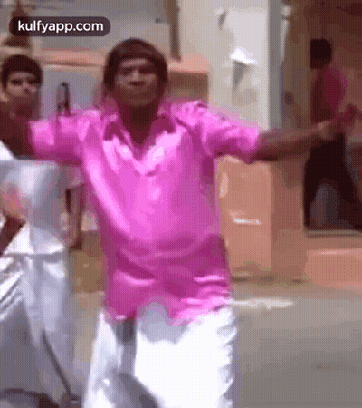 Man In Pink Shirt Dancing With Arms Outstretched GIF