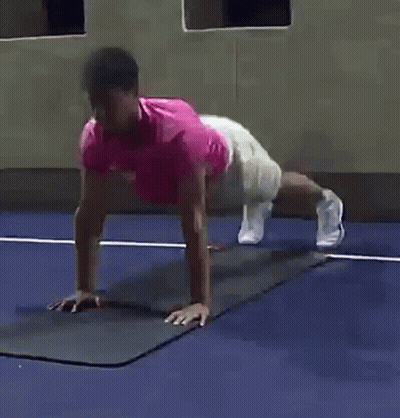 Man In Pink Shirt Doing Push Ups GIF