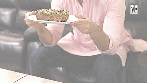 Man In Pink Shirt Holding Cake GIF