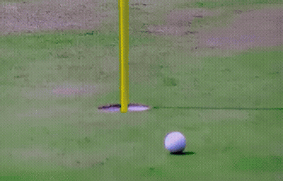 Man In Pink Shirt Holding Golf Ball GIF