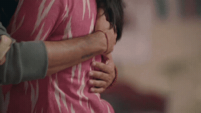 Man In Pink Shirt Hugging Woman In Pink Shirt GIF