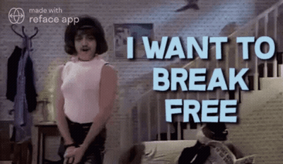 Man In Pink Shirt In Front Of Wall Saying I Want To Break Free GIF