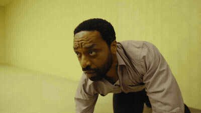 Man In Pink Shirt Kneeling GIF