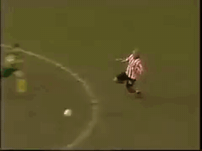 Man In Pink Shirt Lying Before Goalie GIF
