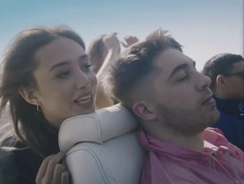 Man In Pink Shirt Next To Woman GIF