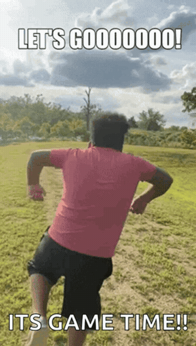 Man In Pink Shirt Running In Field GIF