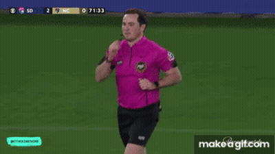 Man In Pink Shirt Running On Soccer Field GIF