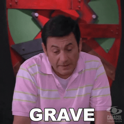 Man In Pink Shirt Saying Grave By Caracol TV Sign GIF